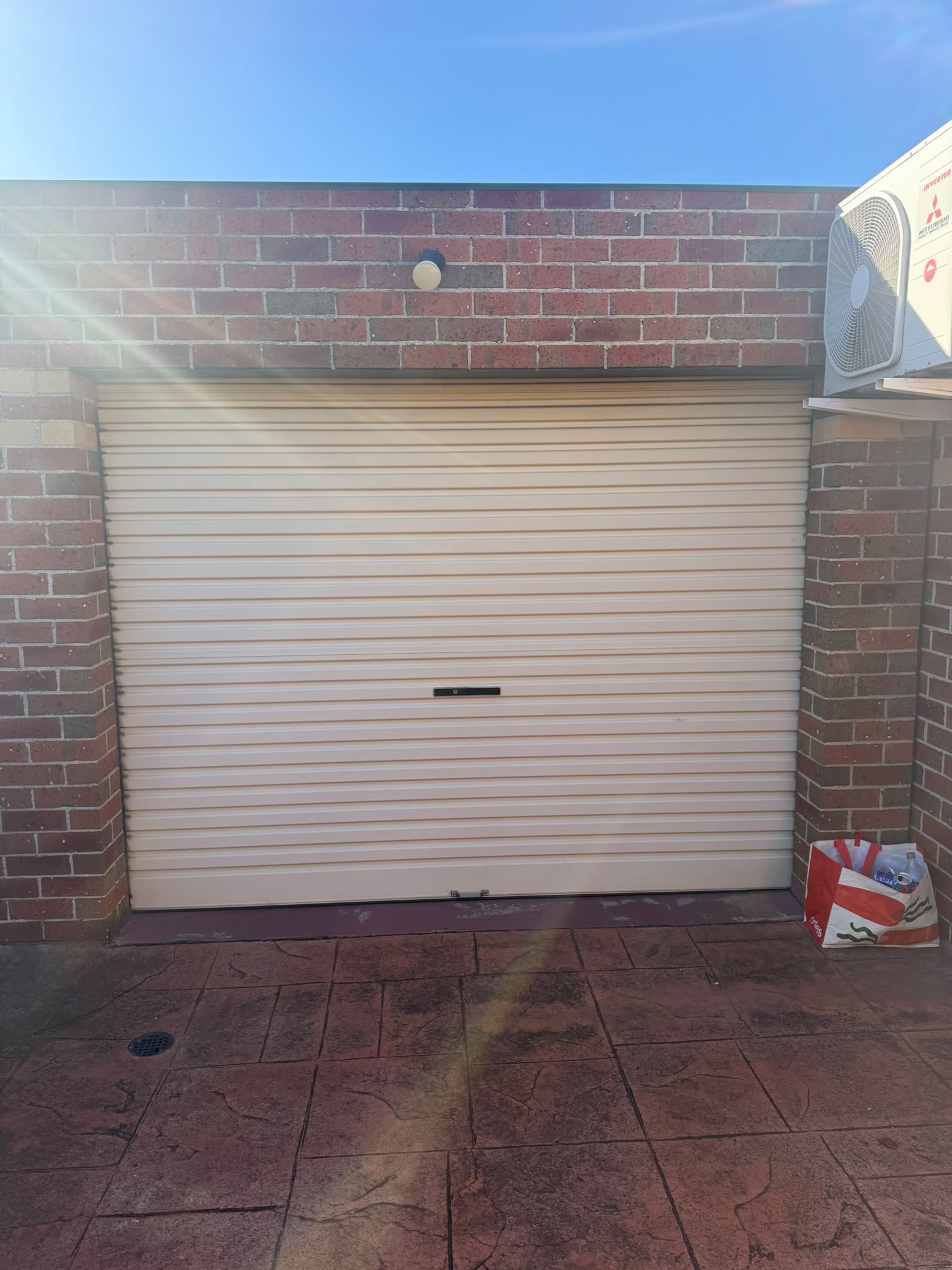 Finished new garage roller door fitted to the front of a home in Melbourne's western suburbs
